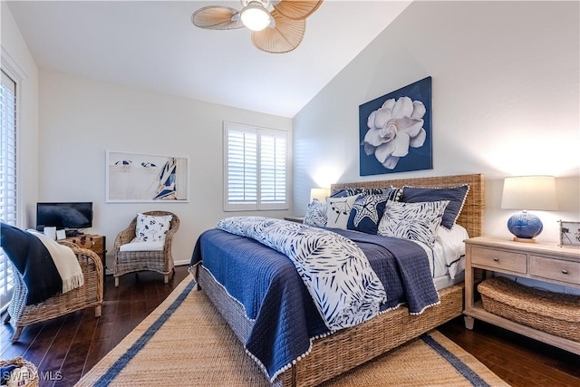 bedroom with hardwood / wood-style floors, vaulted ceiling, and ceiling fan