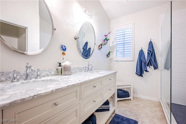 bathroom with double vanity and tiled shower