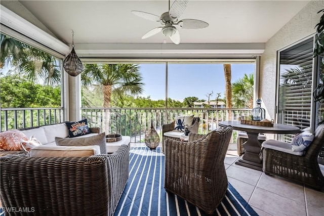 sunroom / solarium featuring ceiling fan, vaulted ceiling, and an outdoor hangout area