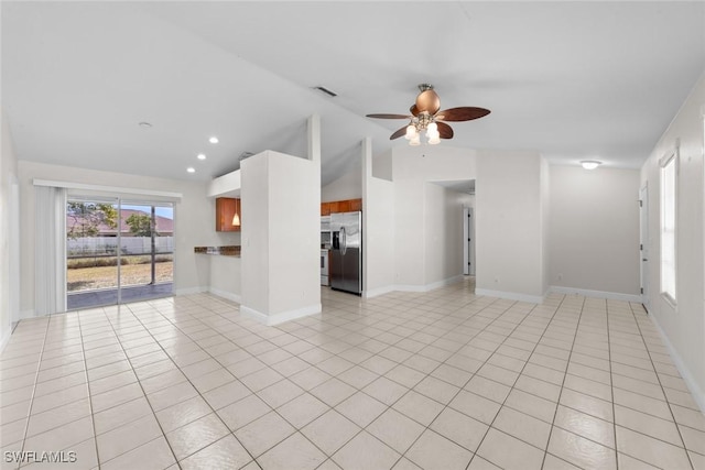 unfurnished living room featuring light tile patterned floors, visible vents, ceiling fan, vaulted ceiling, and recessed lighting