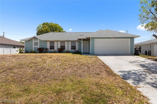 single story home featuring fence, a garage, a front lawn, and driveway