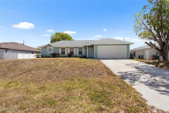 single story home with a front yard, driveway, a garage, and fence