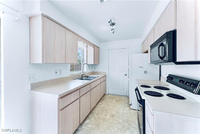 kitchen with electric range oven, a sink, black microwave, and light brown cabinets