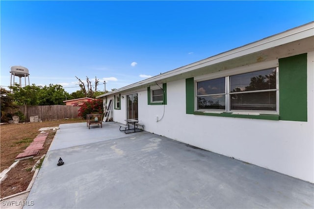 view of patio featuring fence