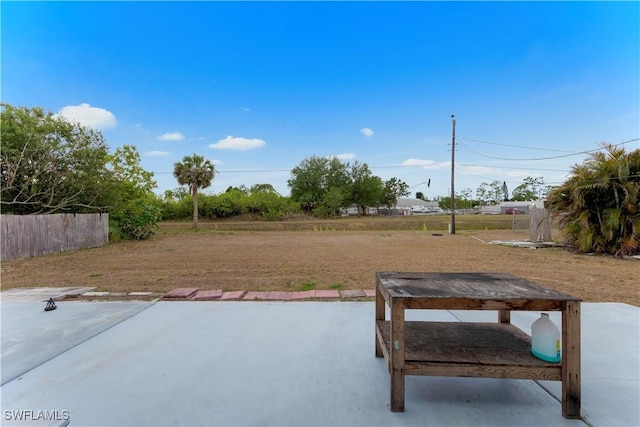 view of patio featuring fence
