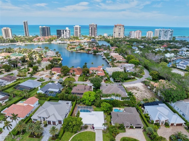 aerial view of residential area with a nearby body of water