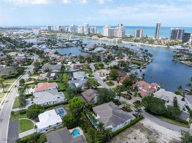 view of urban area featuring a nearby body of water and nearby suburban area