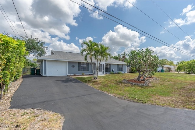 5295 17th Ave SW, Naples, FL 34116 - ranch-style home featuring driveway, stucco siding, an attached garage, and a front yard