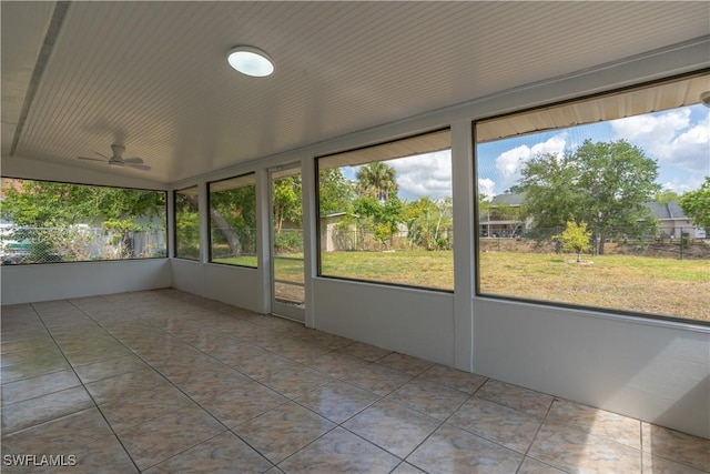 5295 17th Ave SW, Naples, FL 34116 - unfurnished sunroom with plenty of natural light and a ceiling fan