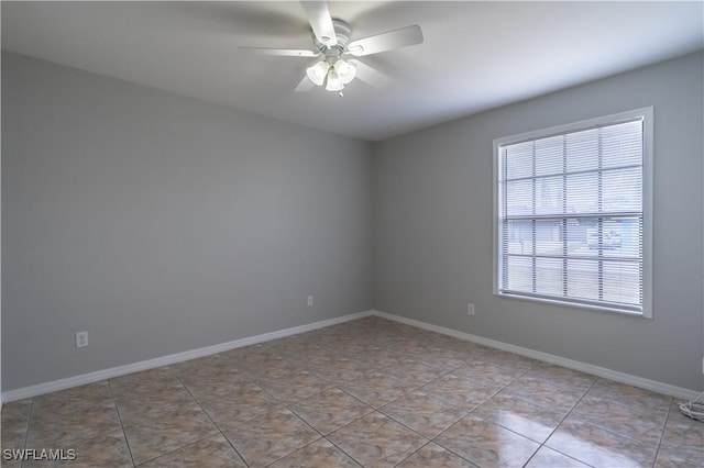 5295 17th Ave SW, Naples, FL 34116 - spare room featuring a ceiling fan, baseboards, and light tile patterned floors