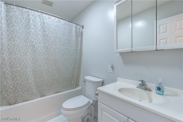 5295 17th Ave SW, Naples, FL 34116 - full bathroom featuring toilet, visible vents, vanity, and shower / tub combo with curtain