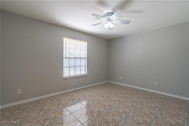 5295 17th Ave SW, Naples, FL 34116 - spare room with tile patterned flooring, baseboards, and a ceiling fan