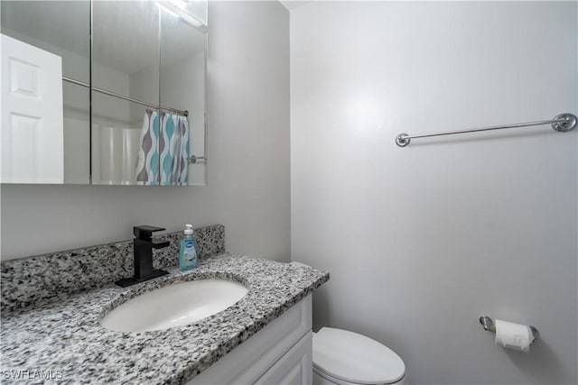 5295 17th Ave SW, Naples, FL 34116 - full bath featuring vanity, toilet, and a shower with shower curtain