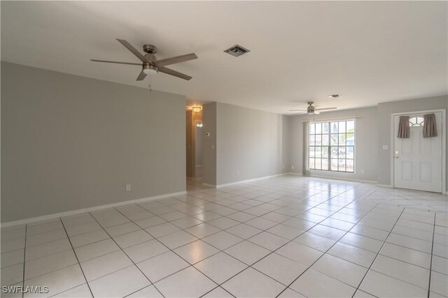 5295 17th Ave SW, Naples, FL 34116 - unfurnished room with ceiling fan, light tile patterned flooring, baseboards, and visible vents