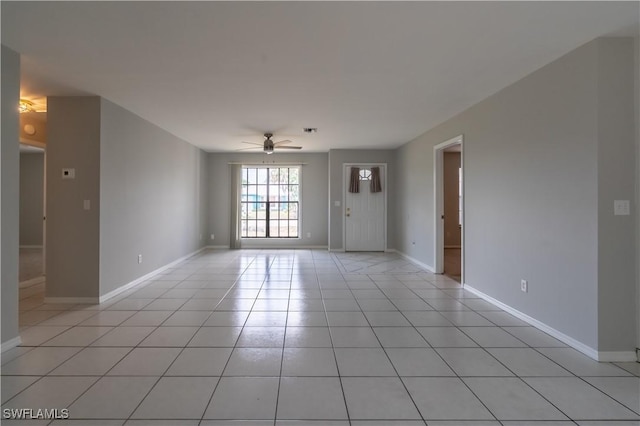 5295 17th Ave SW, Naples, FL 34116 - spare room with ceiling fan, baseboards, and light tile patterned floors