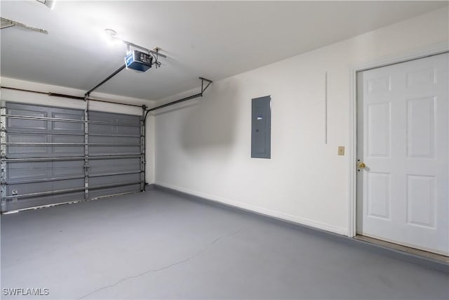 5295 17th Ave SW, Naples, FL 34116 - garage with electric panel, baseboards, and a garage door opener