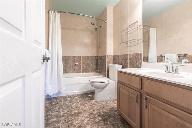 full bathroom featuring tile walls, vanity, toilet, and shower / bath combination with curtain