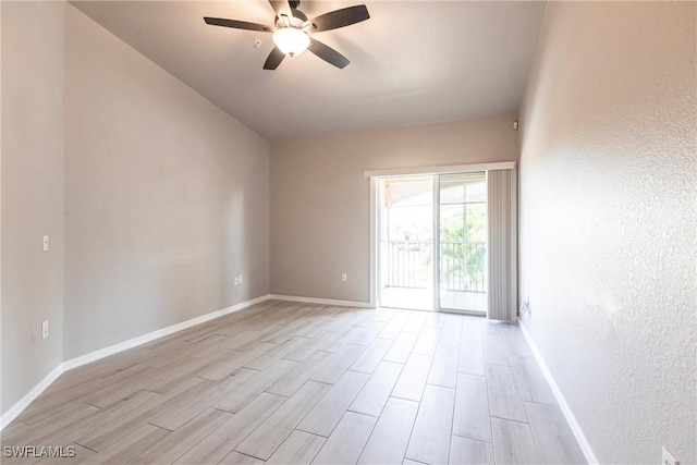 unfurnished room with baseboards, light wood-style floors, and ceiling fan
