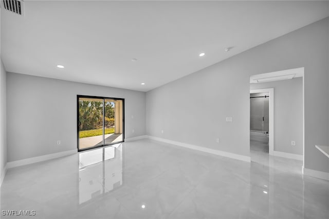 spare room with visible vents, baseboards, and recessed lighting