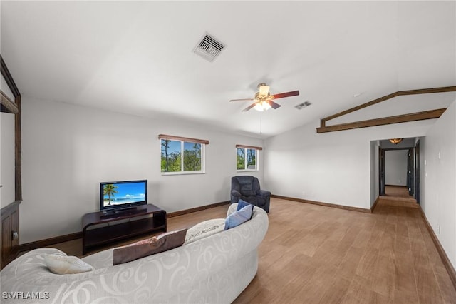 8625 Redwood Dr, Saint James City, FL 33956 - living area featuring ceiling fan, light wood-type flooring, baseboards, and vaulted ceiling