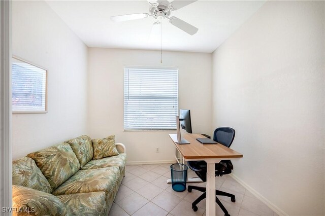 office area featuring healthy amount of natural light, light tile patterned floors, and ceiling fan