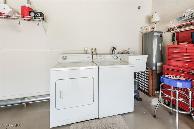 laundry area with separate washer and dryer and electric water heater