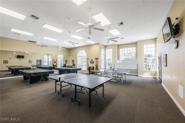 game room featuring ceiling fan, baseboards, and carpet