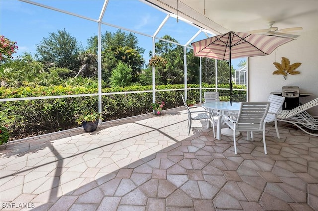 view of patio / terrace featuring ceiling fan, outdoor dining area, a lanai, and grilling area