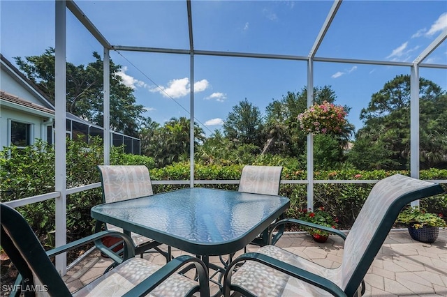 sunroom with outdoor dining space