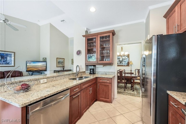 kitchen with appliances with stainless steel finishes, a sink, a peninsula, light tile patterned flooring, and glass insert cabinets