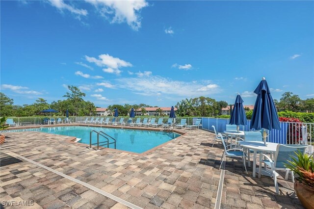 917 Fairhaven Ct Unit 29, Naples, FL 34104 - community pool featuring a patio