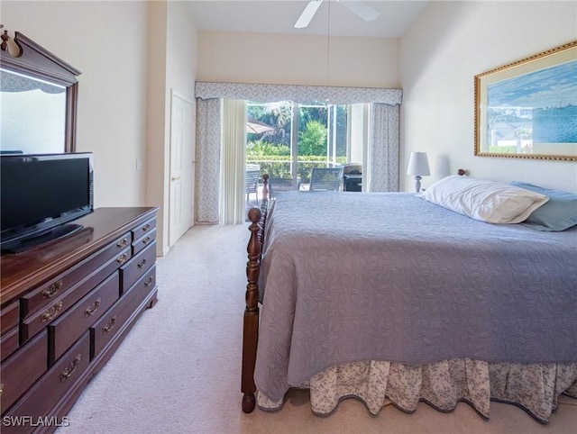 carpeted bedroom with a ceiling fan and access to exterior