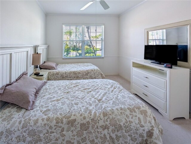 bedroom with light colored carpet, multiple windows, crown molding, and a ceiling fan