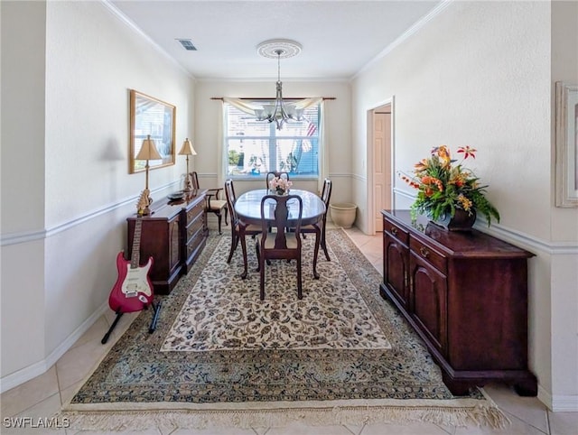 dining room with a chandelier, crown molding, light tile patterned flooring, and baseboards