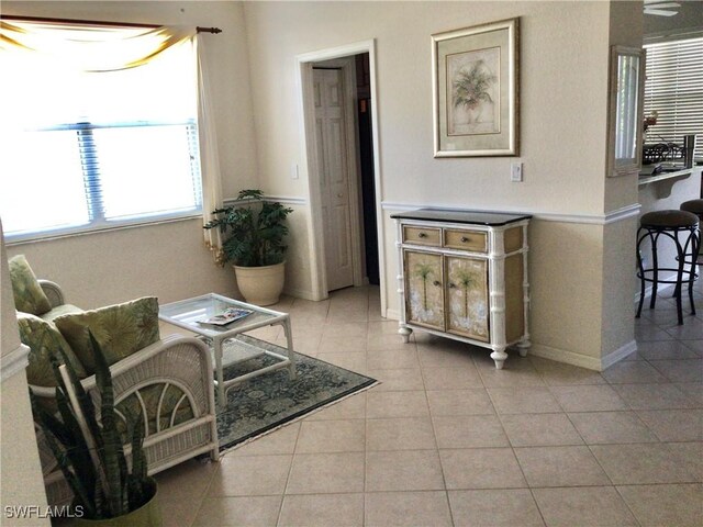 917 Fairhaven Ct Unit 29, Naples, FL 34104 - living room featuring light tile patterned floors and baseboards