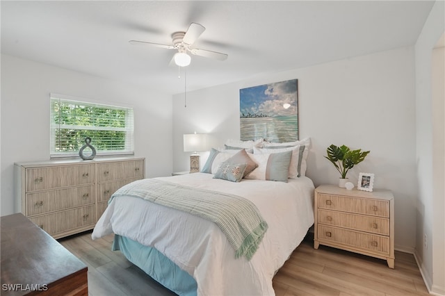 bedroom featuring light wood-type flooring and ceiling fan