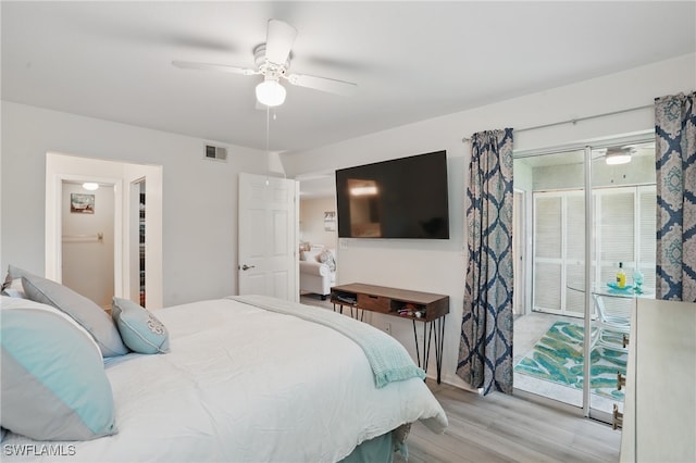 bedroom with light wood-style floors and ceiling fan