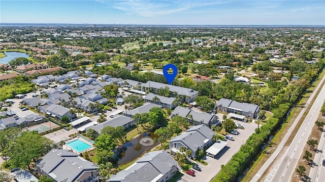 aerial perspective of suburban area featuring a large body of water
