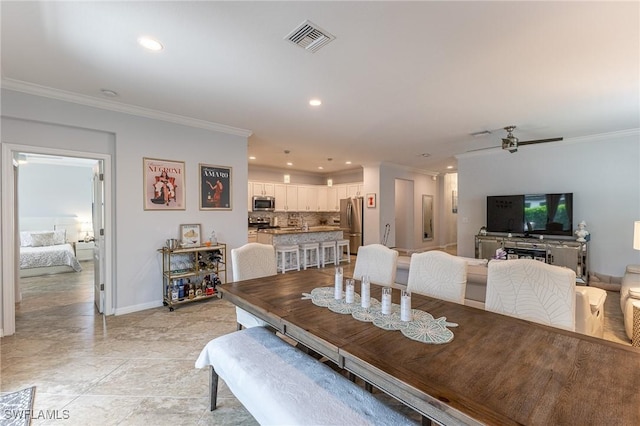 9231 Shadow Oak Ln, Naples, FL 34120 - dining space with crown molding, visible vents, baseboards, and recessed lighting