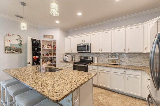 9231 Shadow Oak Ln, Naples, FL 34120 - kitchen with a sink, stainless steel appliances, white cabinetry, backsplash, and ornamental molding