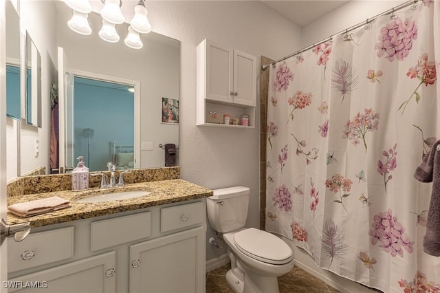 9231 Shadow Oak Ln, Naples, FL 34120 - full bath with toilet, a shower with curtain, tile patterned floors, a chandelier, and vanity
