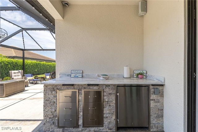 9231 Shadow Oak Ln, Naples, FL 34120 - view of patio / terrace with glass enclosure, area for grilling, and outdoor wet bar