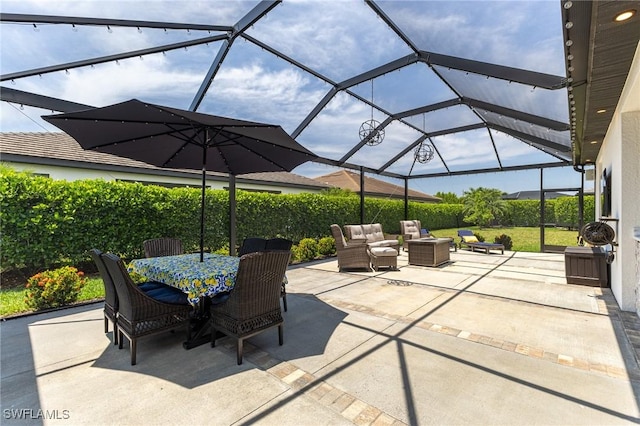 9231 Shadow Oak Ln, Naples, FL 34120 - view of patio featuring glass enclosure, outdoor dining area, and outdoor lounge area