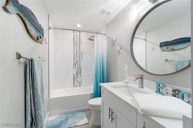 full bath featuring toilet, vanity, shower / bath combo, and recessed lighting