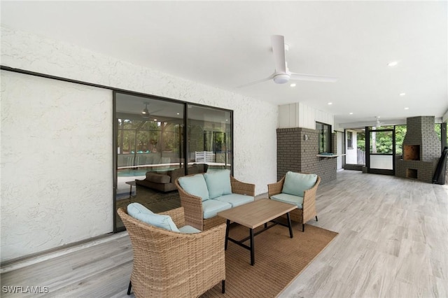 view of patio / terrace with ceiling fan, outdoor lounge area, and a wooden deck