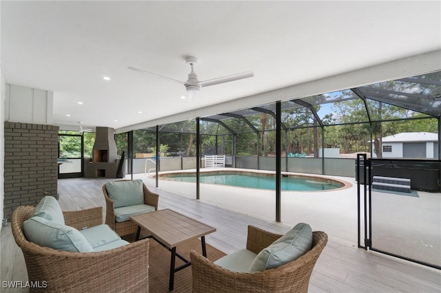 outdoor pool featuring a hot tub, an outdoor living space, ceiling fan, and a patio area