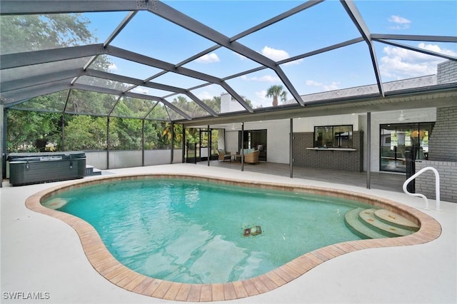 swimming pool featuring a patio, a hot tub, and glass enclosure