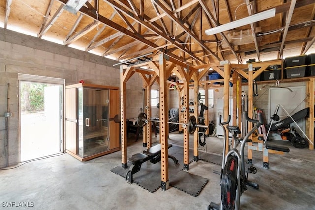 workout room with concrete block wall