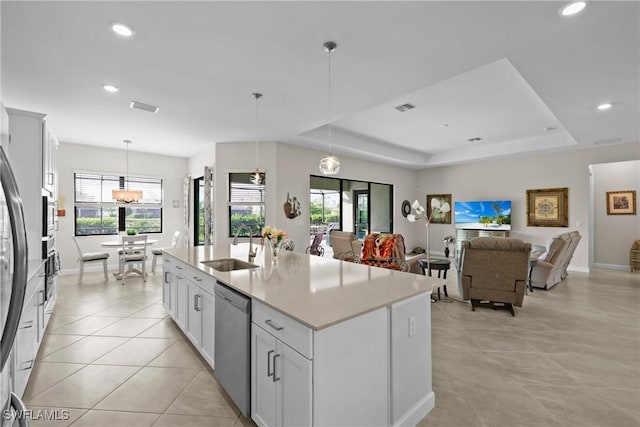 kitchen with recessed lighting, dishwasher, hanging light fixtures, visible vents, and a sink