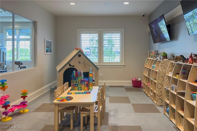 playroom with tile patterned floors, baseboards, and recessed lighting
